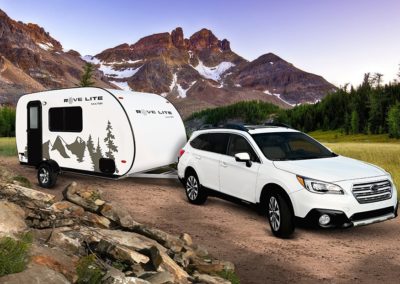 Ultra-Lite Travel Trailer Towed By Subaru Sedan