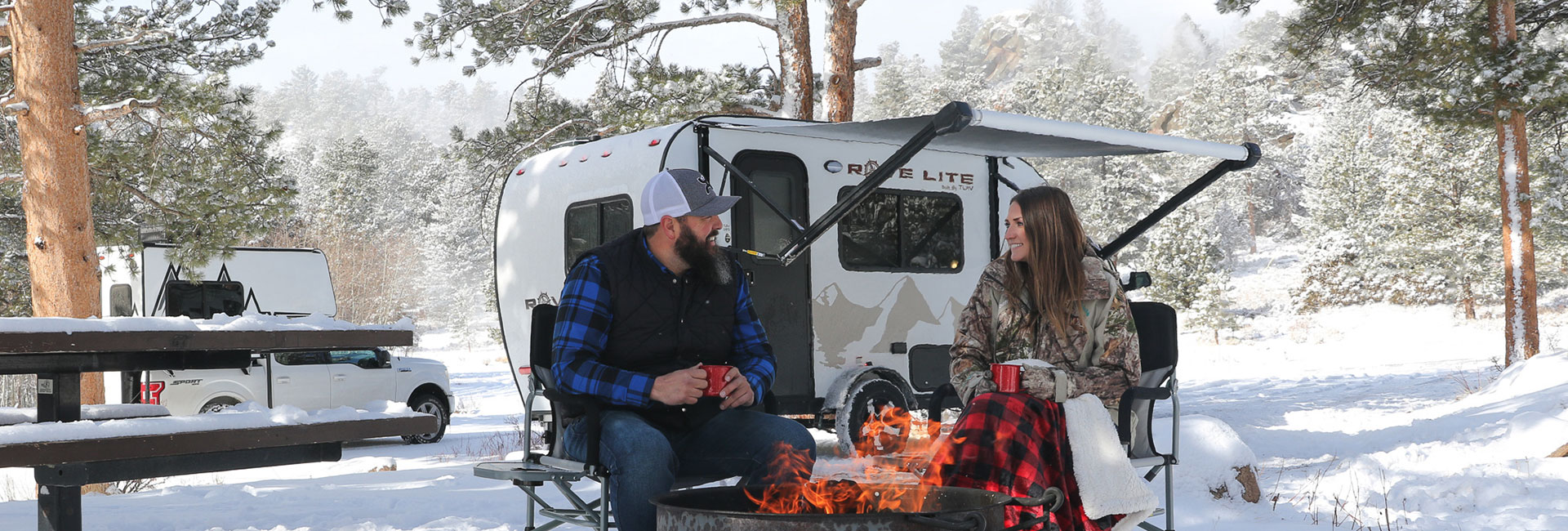 People sitting around a camp fire