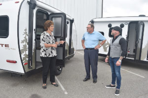 U.S. Rep. Jackie Walorski (R-Dist. 2) gestures as she speaks with Travel Lite RV investor Bruce Korenstra and CEO Ryan Rebar (R) during a visit to the Syracuse, Ind.-based OEM on Monday (Aug. 9). (Photo credit: Gary Gerard/RVBusiness)