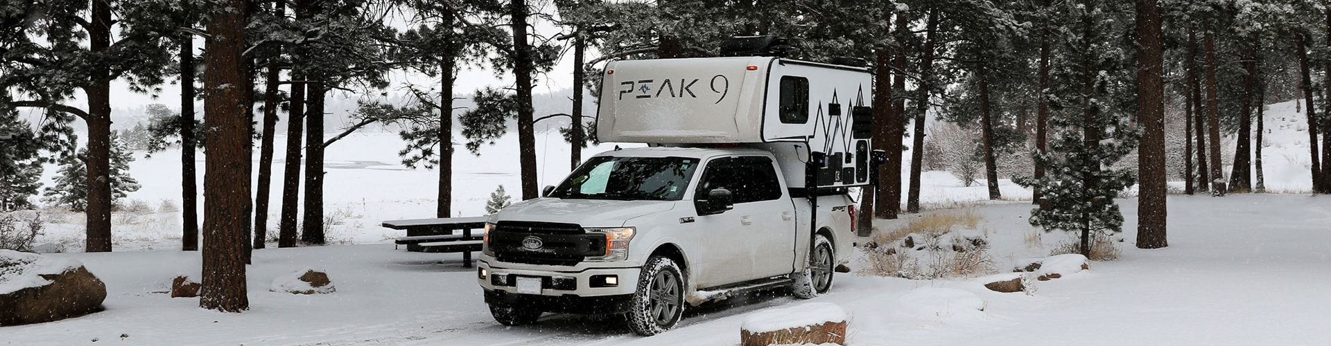 Truck camper in the snow